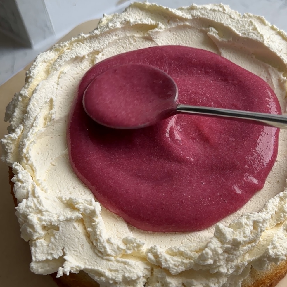 Pink and vibrant blackberry curd on cake